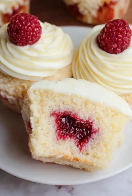 Almond Wedding Cake Cupcakes with Raspberry Filling